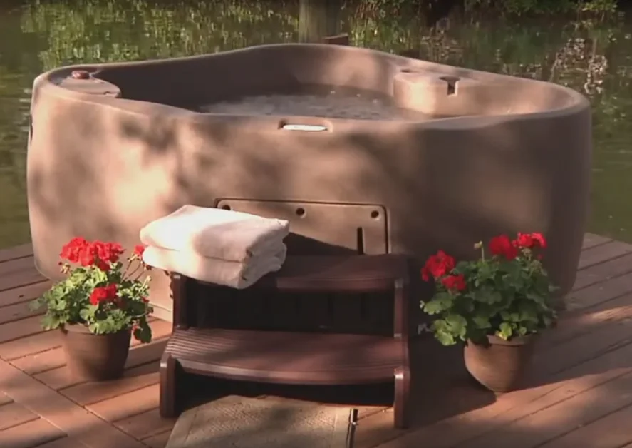 120v Hot Tub 2-Person: Affordable, Space-Saving, Relaxation<gwmw style="display:none;"></gwmw> 3 A AquaRest Spas Select 300 hot tub placed at a oudoor space.