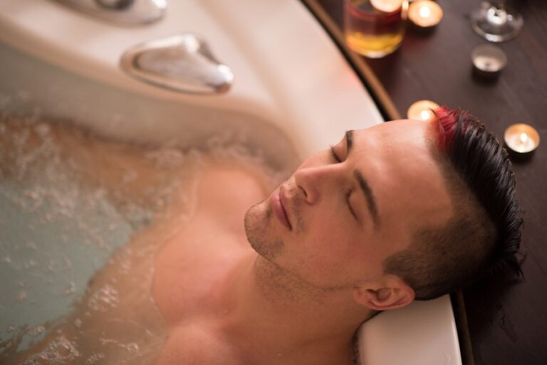 A young man relaxing in a after hot tub therapy for knee replacement.