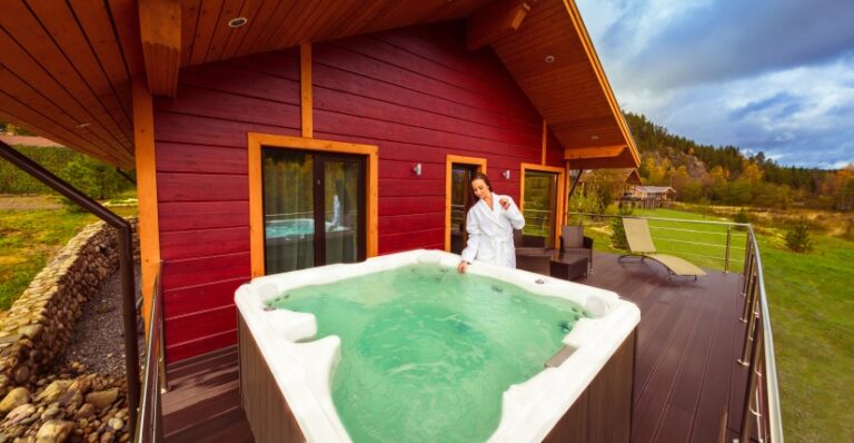 A woman with white robe ready to use a Hot Tub