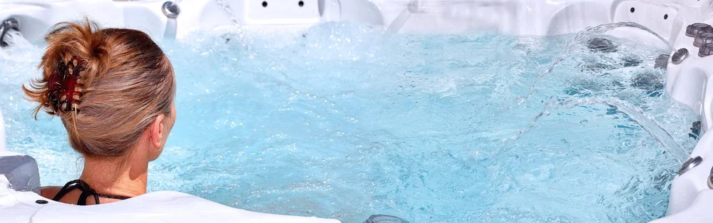 Woman enjoying a hot tub in clear water during her period. (Period In Hot Tub)