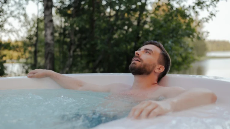 A man relaxing in a 2-Person Hot Tub 220 Volt