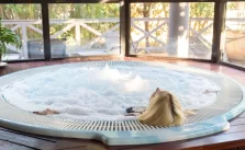 A woman enjoying in a 4 Season Inflatable Hot Tub with water bubbling