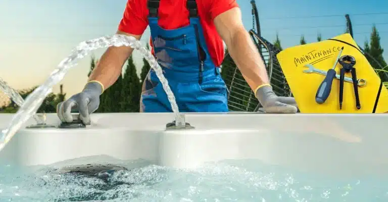 Skilled professional performing thorough hot tub maintenance