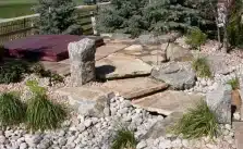 A hot tub covered with cover in a wild garden