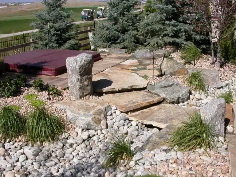 A hot tub covered with cover in a wild garden