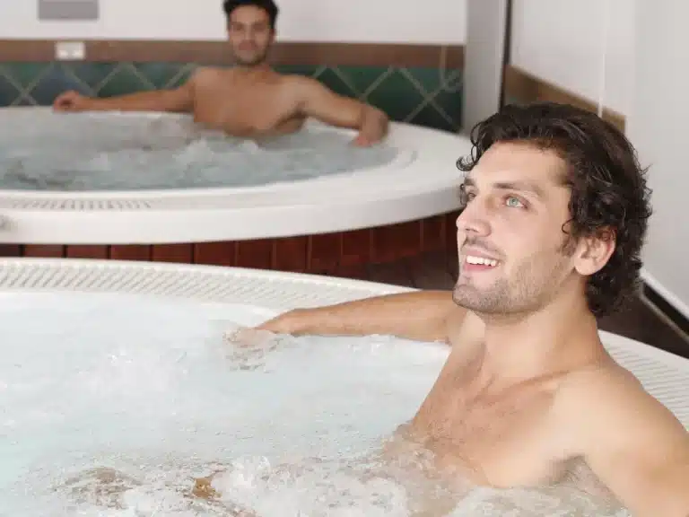 Two men doing Hot Tubbing in a spa