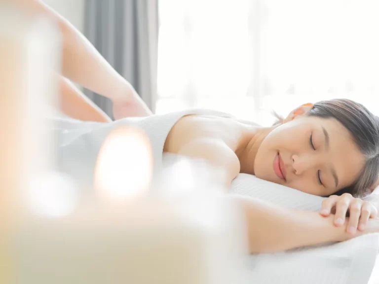 A young woman taking Benefits of Asian Massage in a parlor