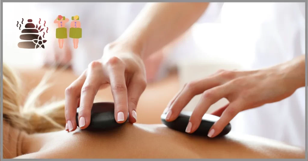 A therapist performing a Hot Stone Massage on a woman. (Pros and Cons of Hot Stone Massage)