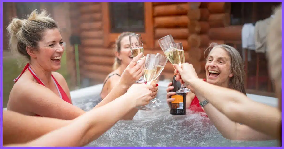 Five people in a hot tub. (Does Drinking in a Hot Tub Get you Drunk Faster)