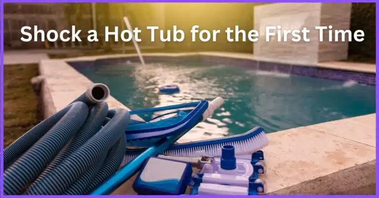 A blue hot tub with a fountain and a pool in the background, surrounded by pool cleaning equipment and a stone wall.