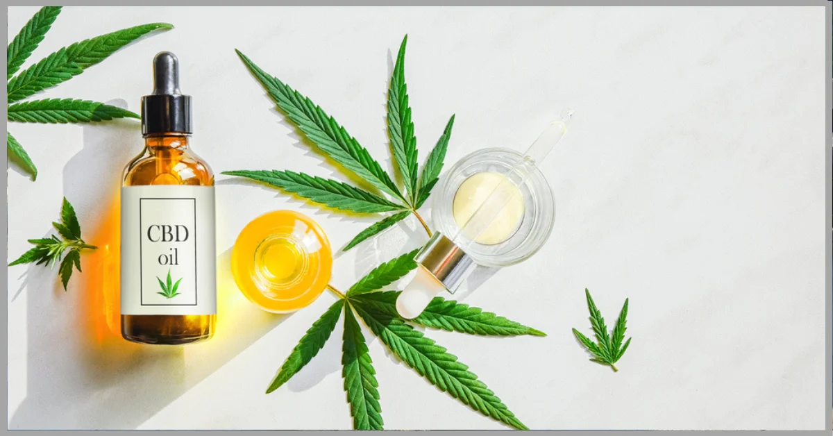 A photo of CBD oil products and cannabis leaves on a white background.