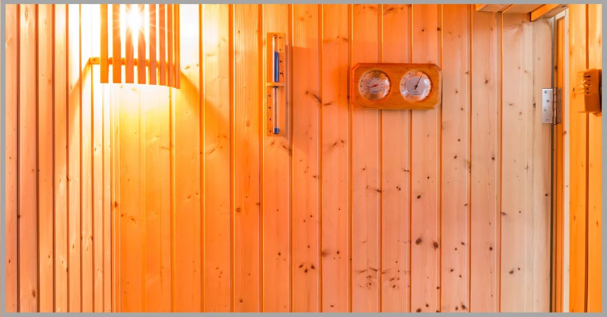 A Sand Timer in the Sauna on a wooden wall with lights.