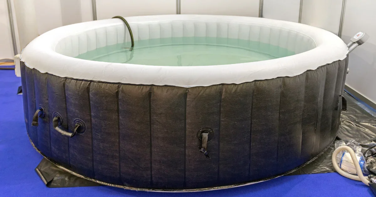 A Inflatable Hot Tub with full of water.