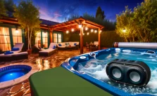 Inviting hot tub setting featuring stylish waterproof Bluetooth speakers integrated into a serene outdoor patio area under starlit sky.