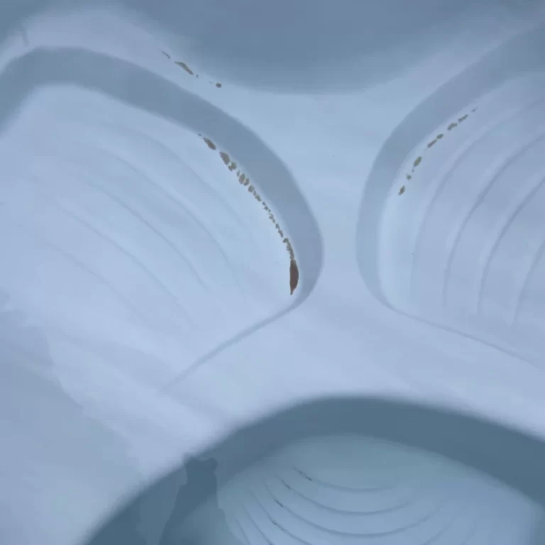 How to Get Sand Out of a Hot Tub: 5 Safe Methods 9 A hot tub with sand in bottom.