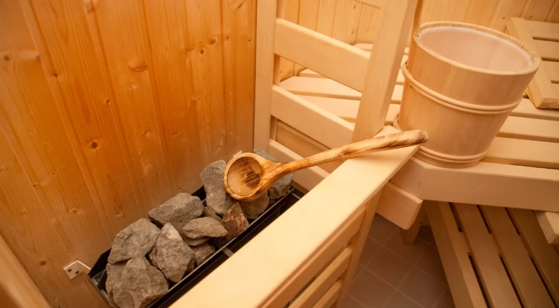 A sauna with accessories like hot stone etc.