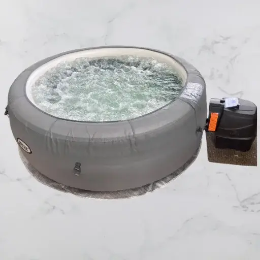 AIntex Simple Spa 4-Person Inflatable Hot Tub full of water.