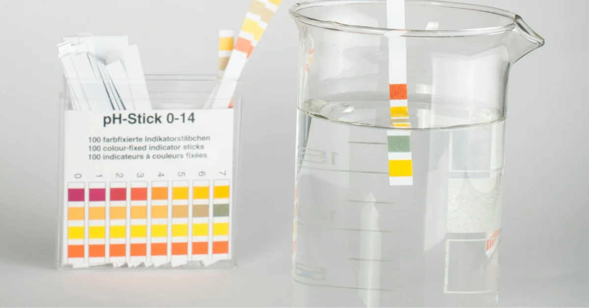 A test strips chart and a strip in a jar.